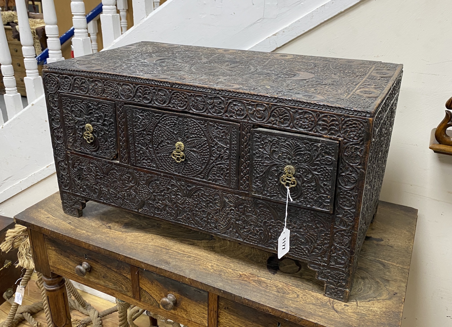 A 19th century rectangular Indian carved hardwood three drawer low table, width 68cm, depth 36cm, height 36cm